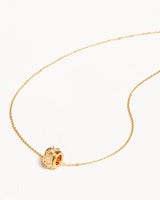 NO FLOWERS SPINNING MEDITATION NECKLACE in Gold from By Charlotte